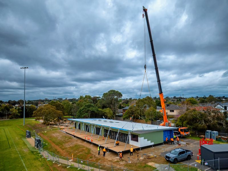 Wide shot of giant crane delivering modules for Brandon Park Reserve pavilion
